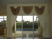 Traditional Swags and Draperies over Large Sliding Door