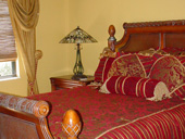 Custom Jensen Beach Master Bedroom with Natural Woven Woods, Cascades and Drapery Panels